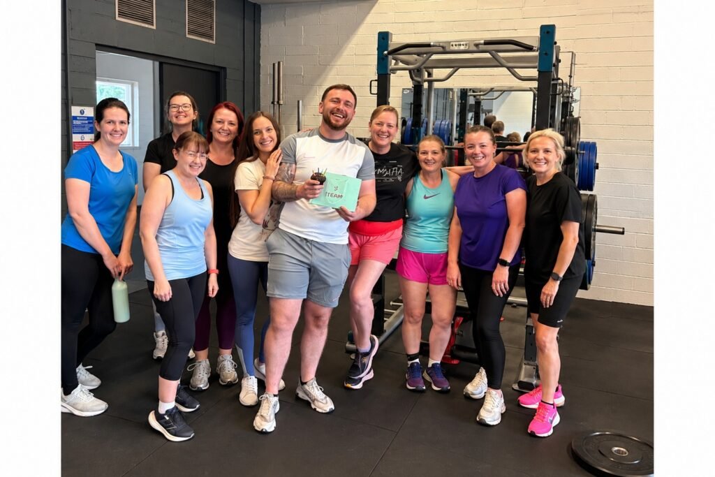 EcoFitness members celebrating together at the studio